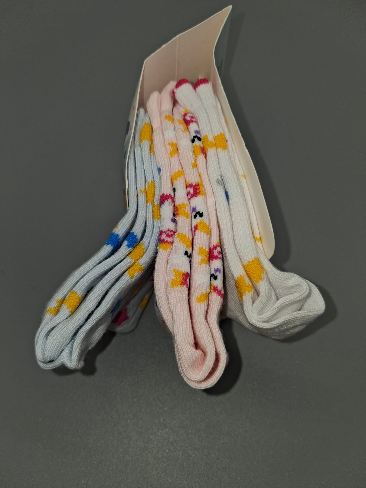 Drei Paar Kindersocken Größe 23–26 mit Stern- und Einhornmotiven
