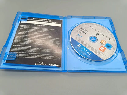 Geöffnete Destiny 2 PS4-Hülle mit Disc und Beileger