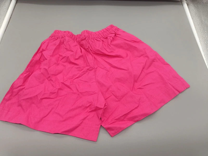Rückseite der pinken Needs Kinder-Shorts Größe 110