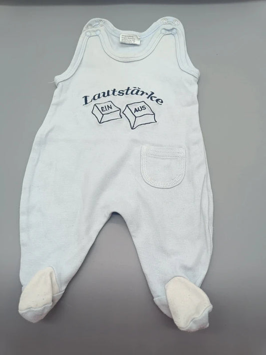 Weißer Baby-Strampler mit Lautstärke EIN/AUS-Motiv und Füßchen