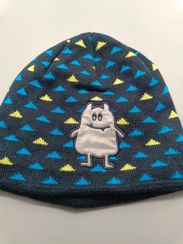 Detail der Monster-Applikation und des blau-gelben Musters