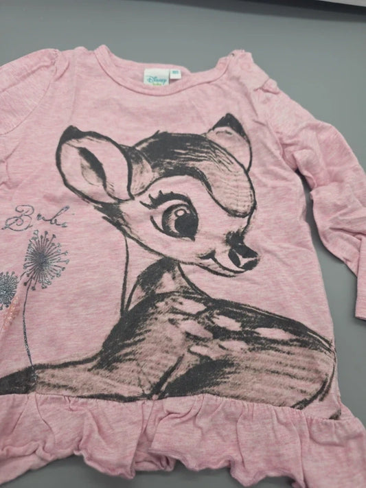 Detail des Bambi-Motivs und Rüschensaums der Disney Baby Tunika