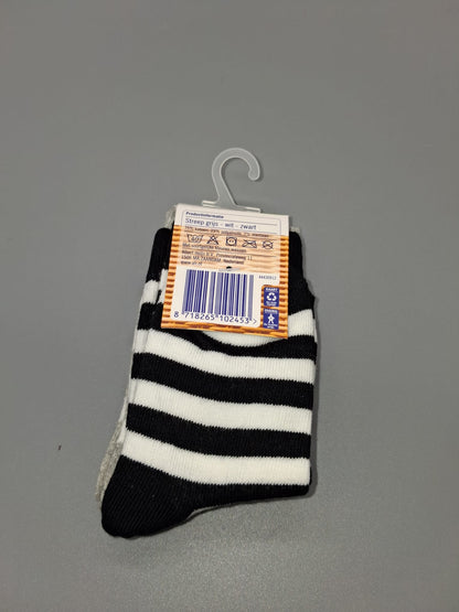 Rückseite des Etiketts der Albert Heijn Kindersocken Größe 23–26