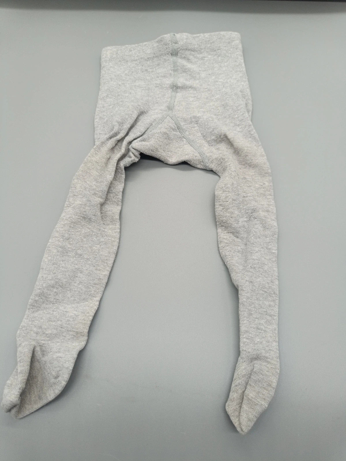 Graue H&M Babystrumpfhose in Größe 50/56